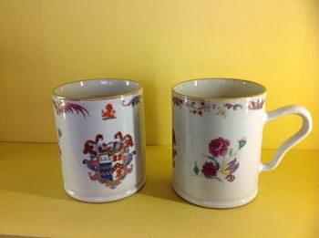 A fine pair of Chinese Export armorial mugs 