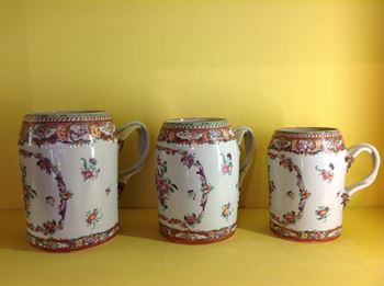 An unusual set of three Chinese Export mugs 