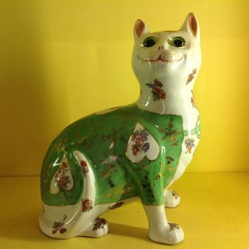 A Galle type faience model of a cat 