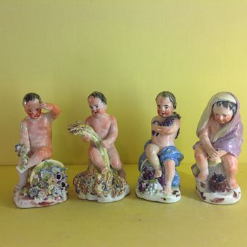 An unusual set of four Continental porcelain figures 