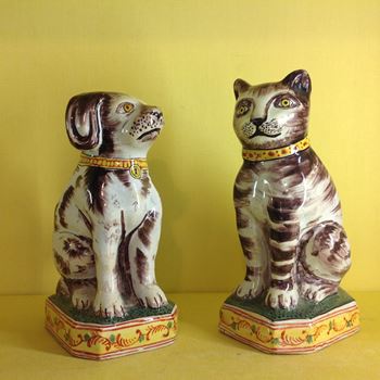 A pair of Dutch Delft models of a cat and dog 
