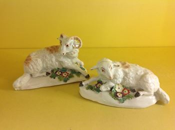 A pair of Derby models of recumbent sheep 