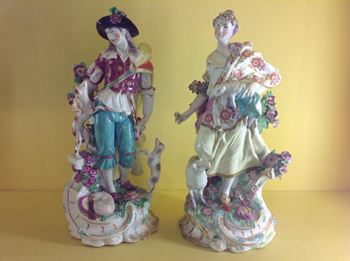 A pair of Chelsea large figures of a shepherd and shepherdess 