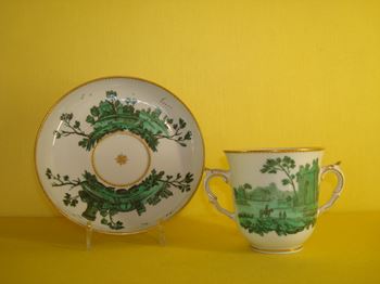 A fine Chelsea two handled chocolate cup and saucer