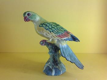 An Anne Gordon faience model of a parrot 