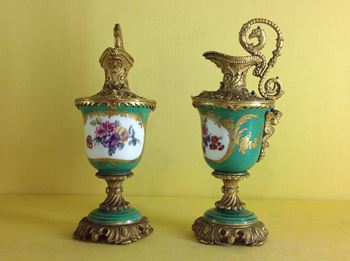 A pair of gilt metal mounted 'Sevres' ewers 