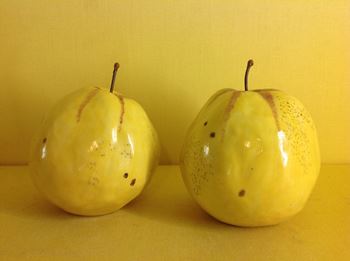 A pair of Anne Gordon models of apples 