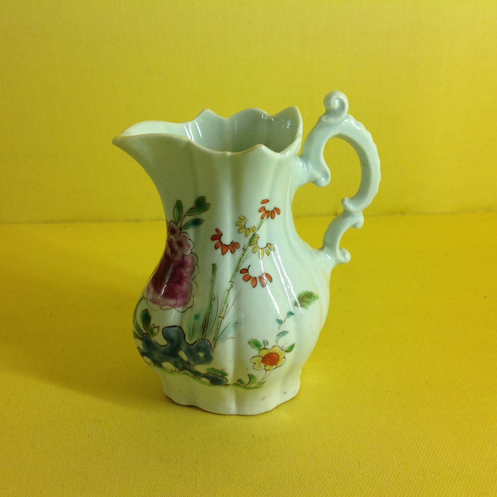 An early Worcester cream jug