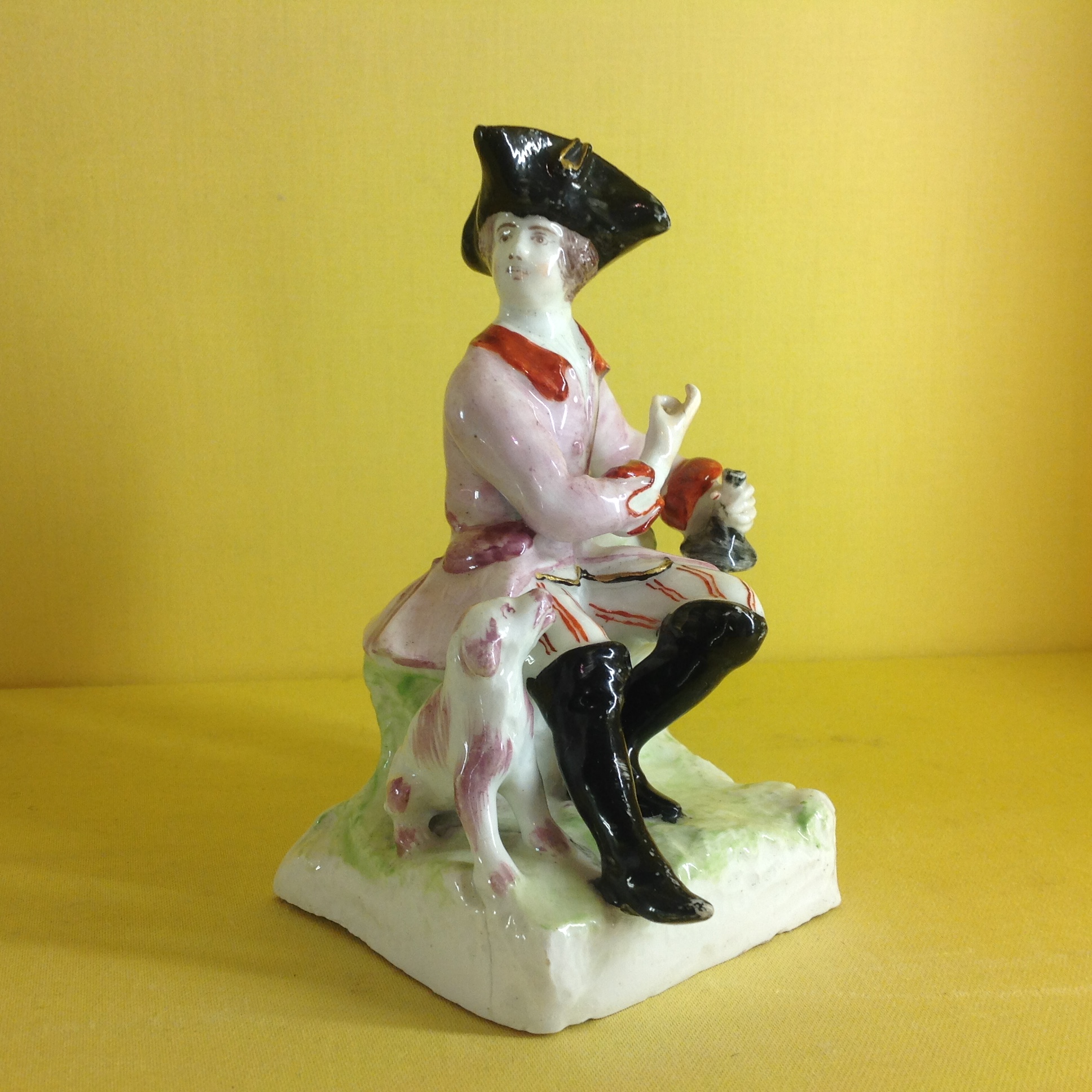 A Bow figure of a sportsman