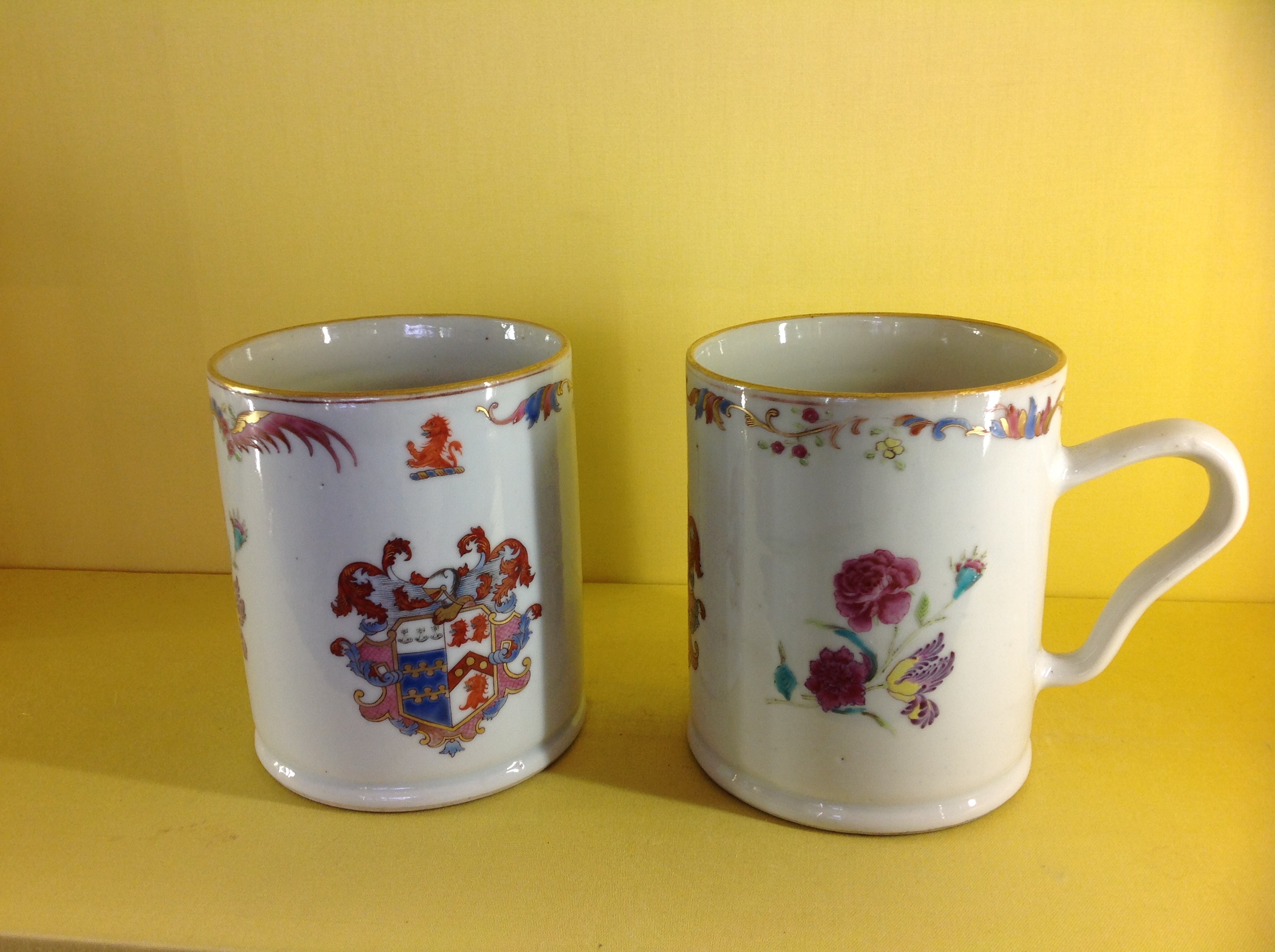 A fine pair of Chinese Export armorial mugs 