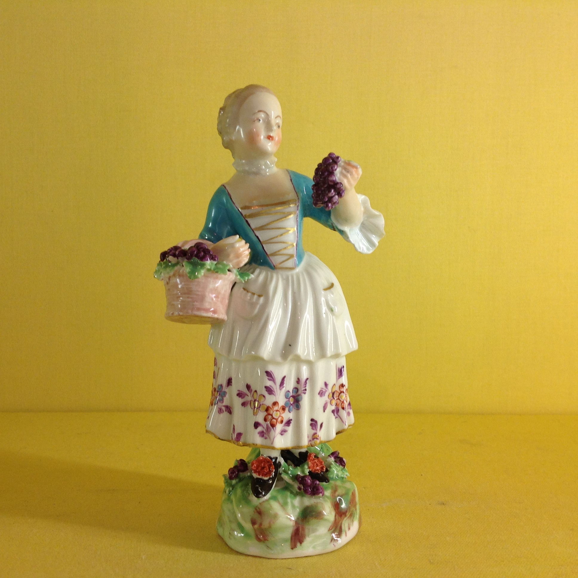 An unusual Derby figure of Autumn