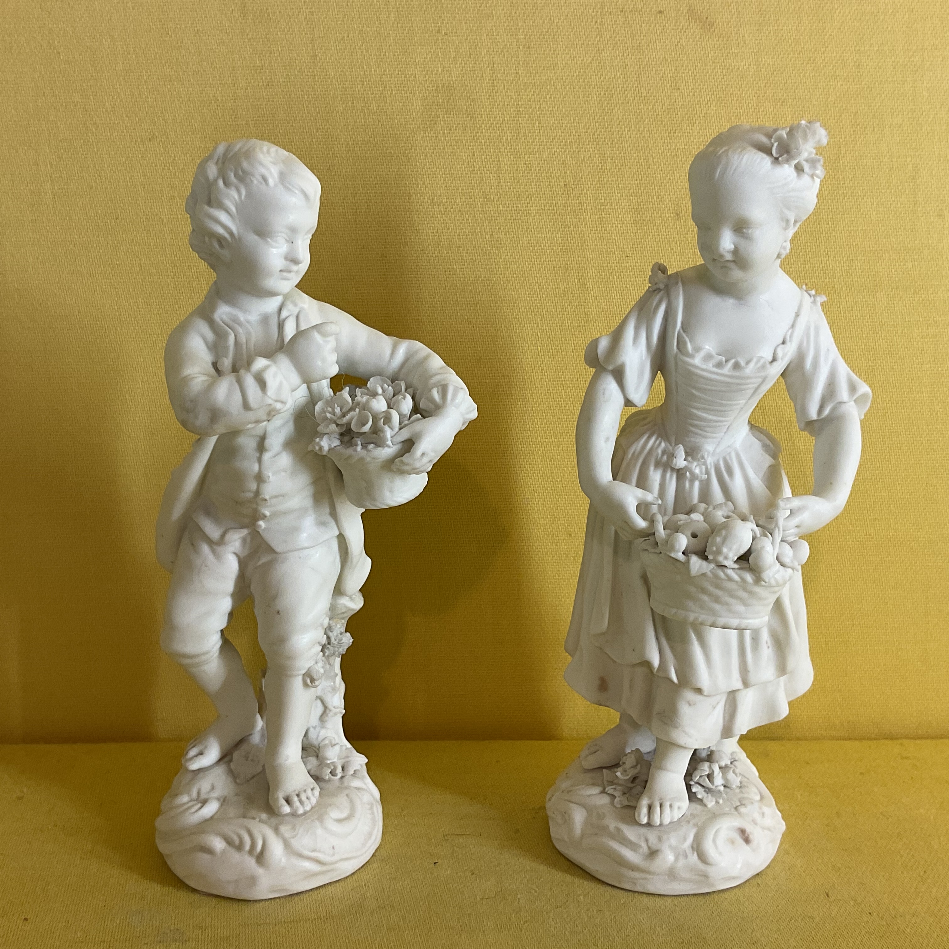 A pair of Derby biscuit porcelain small figures 