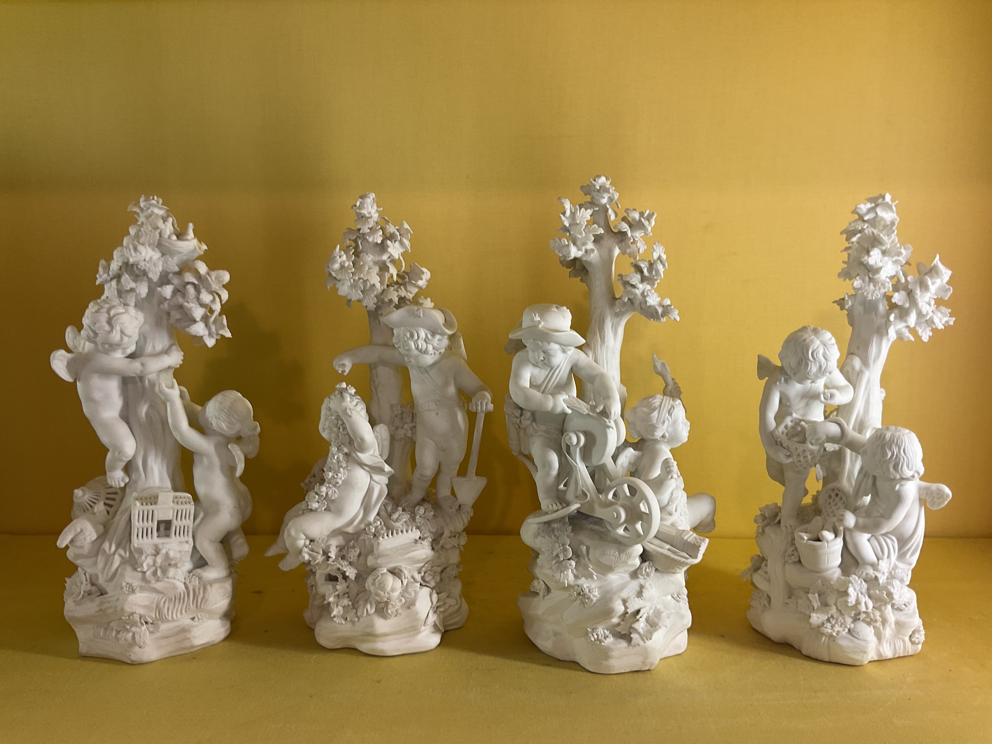 A set of four Derby biscuit porcelain groups, representing The Four Seasons 