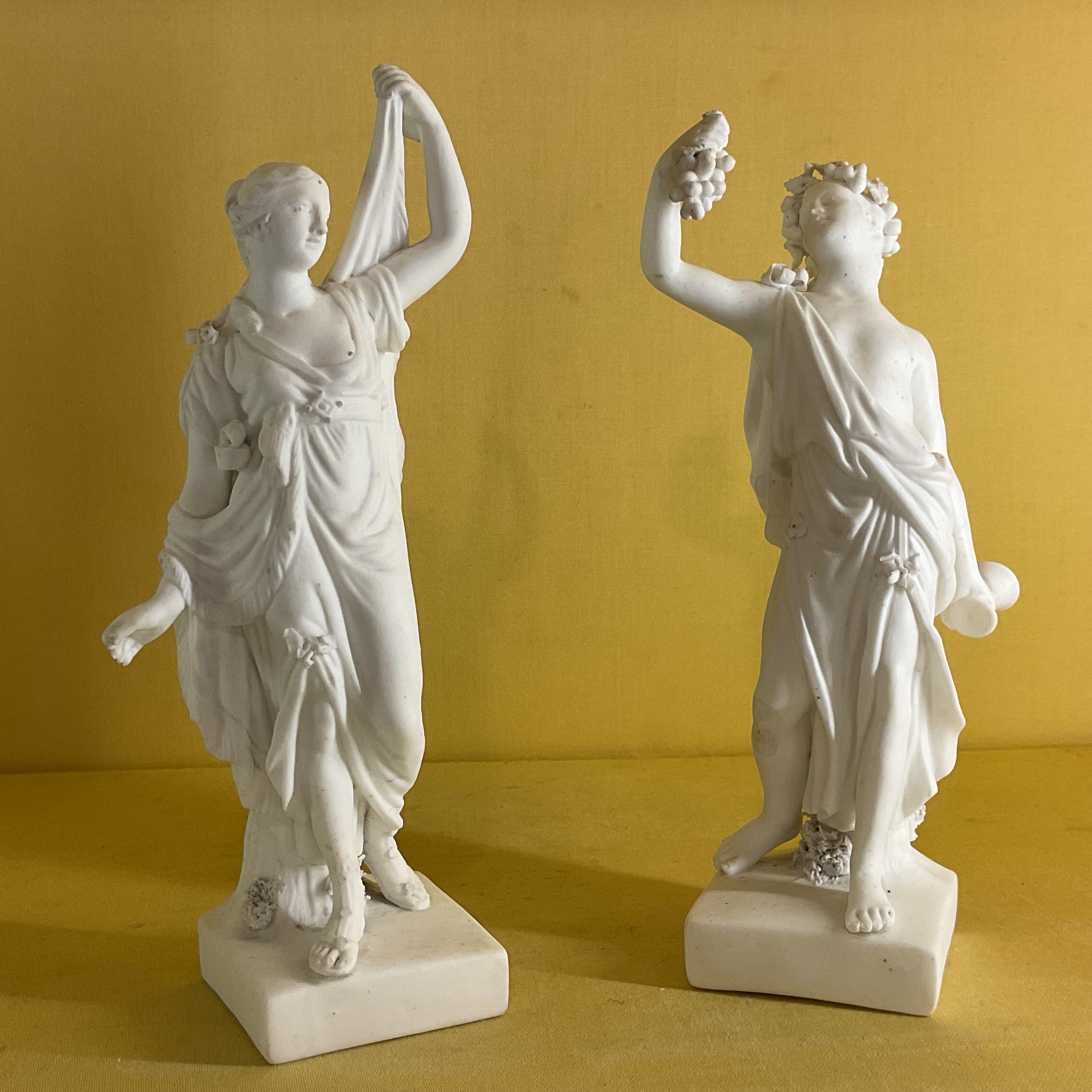 A pair of Derby biscuit porcelain figures 