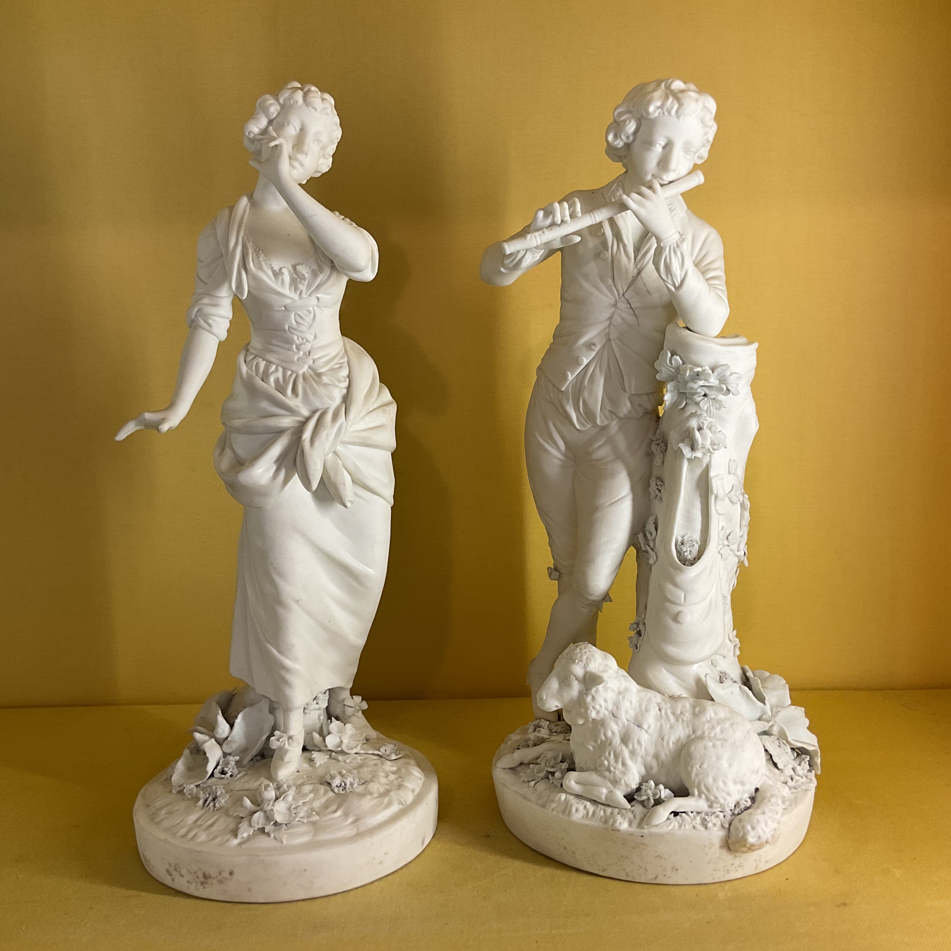 A pair of Derby biscuit porcelain figures 
