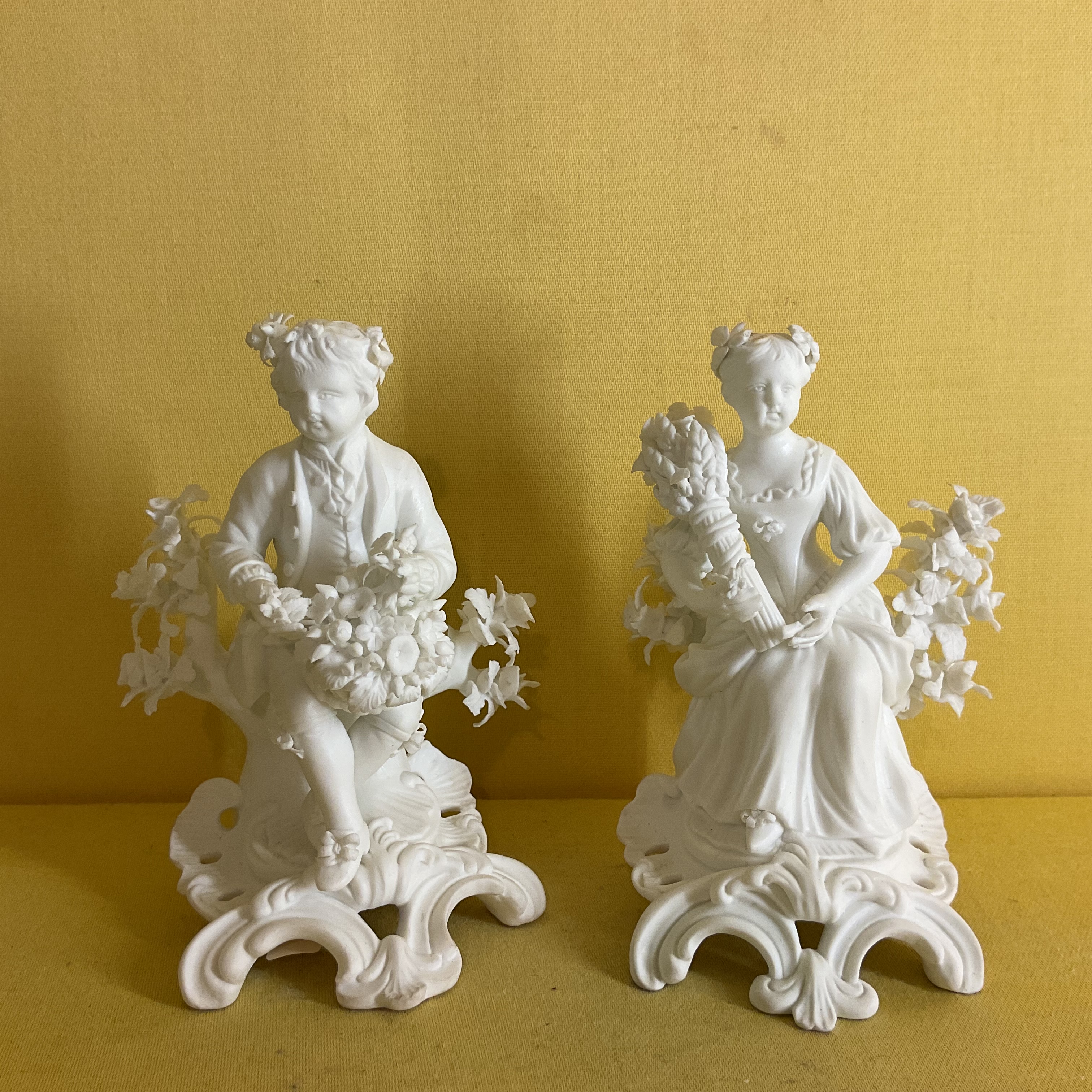 A pair of Derby biscuit porcelain small figures 