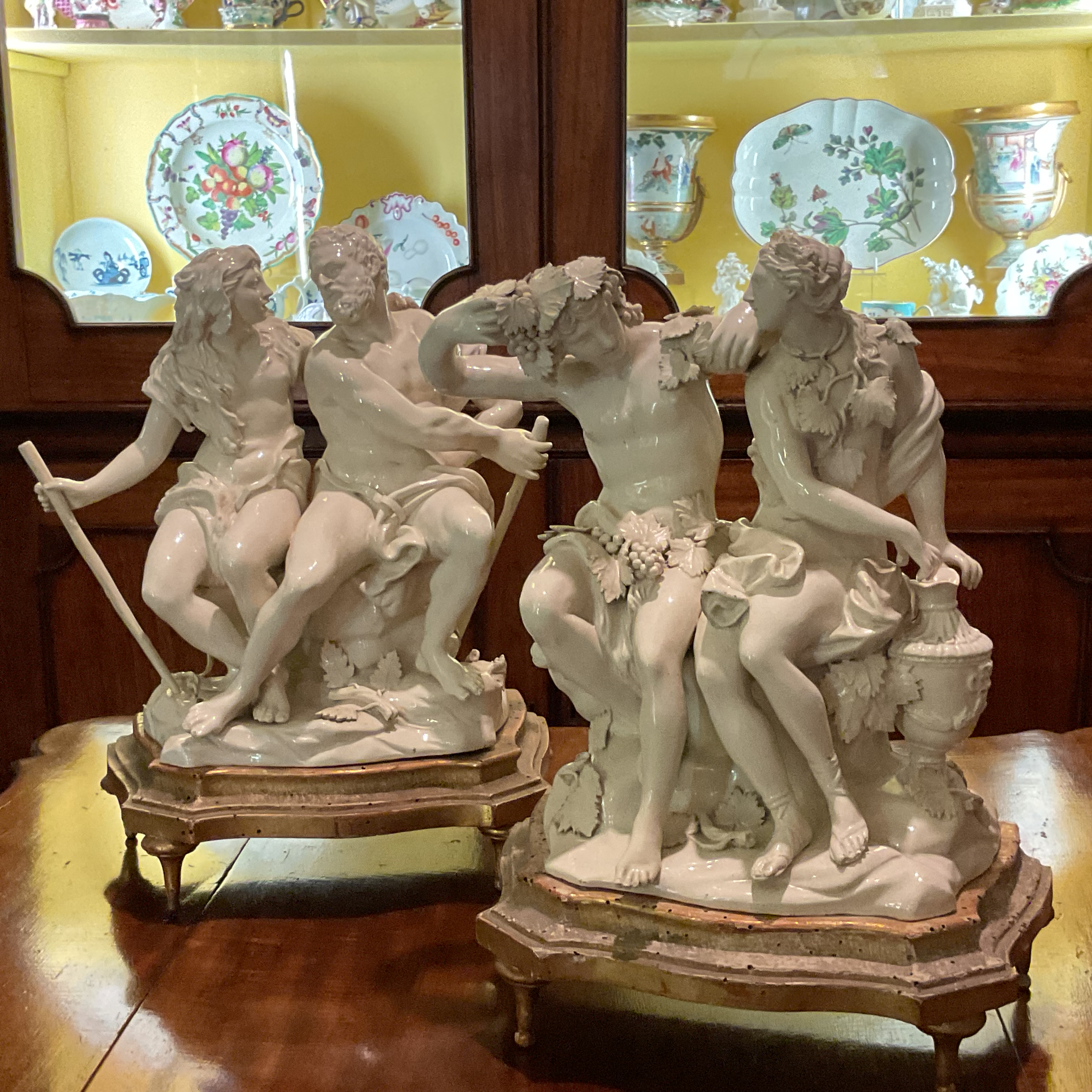 A rare pair of Faenze cream tin glazed earthenware large groups 