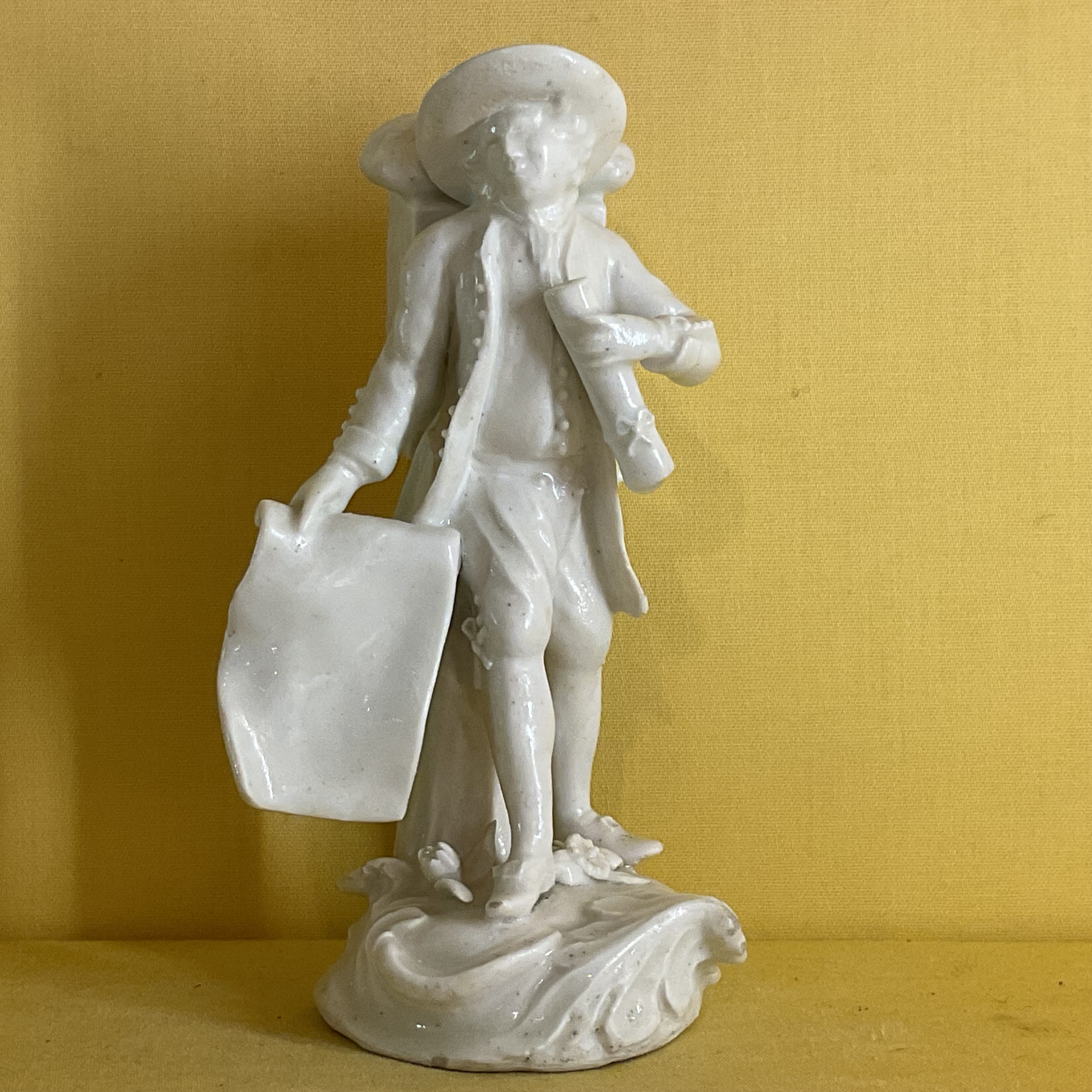 A rare Derby ‘dry edge’ figure of a Map-Seller