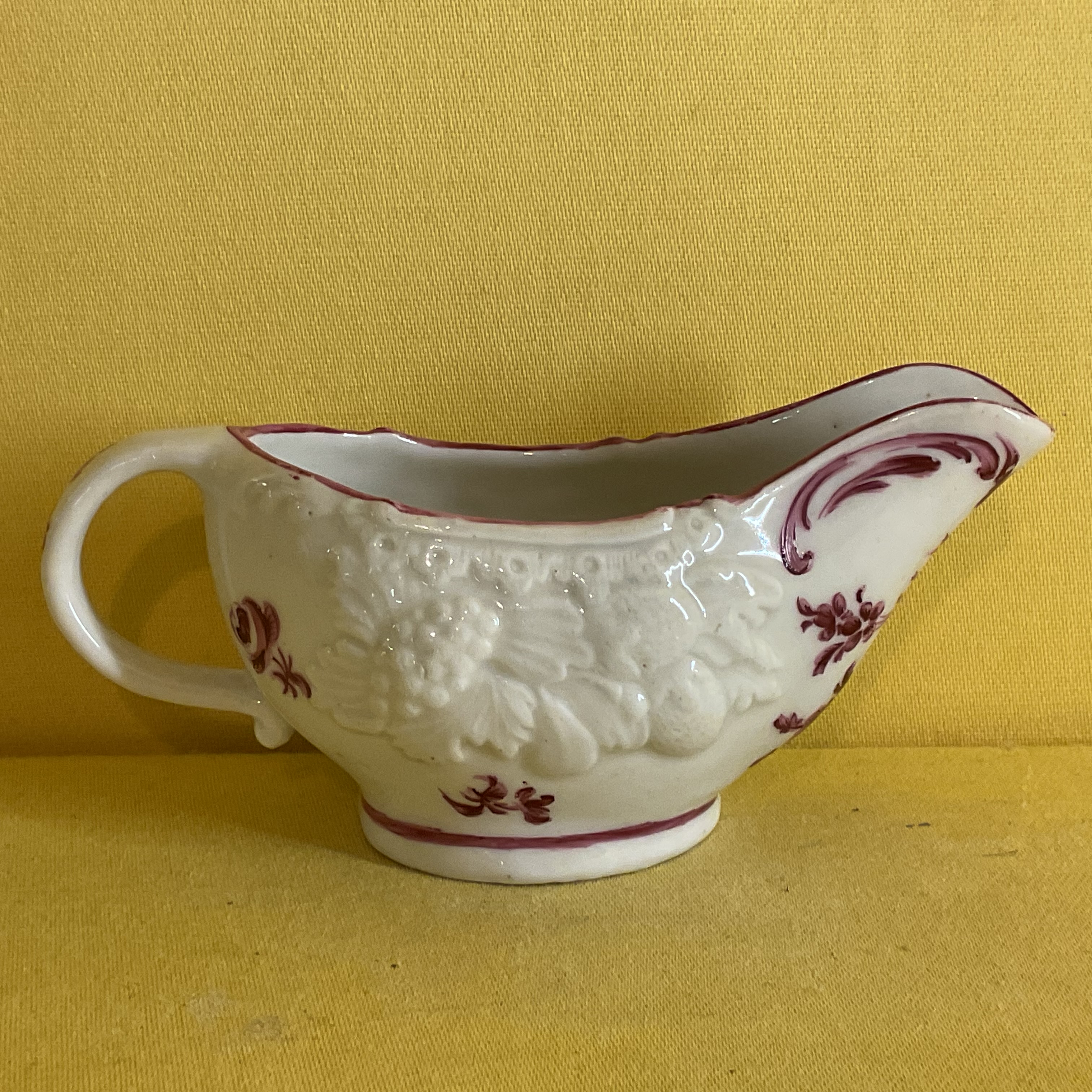 A Bristol small oval butter boat 