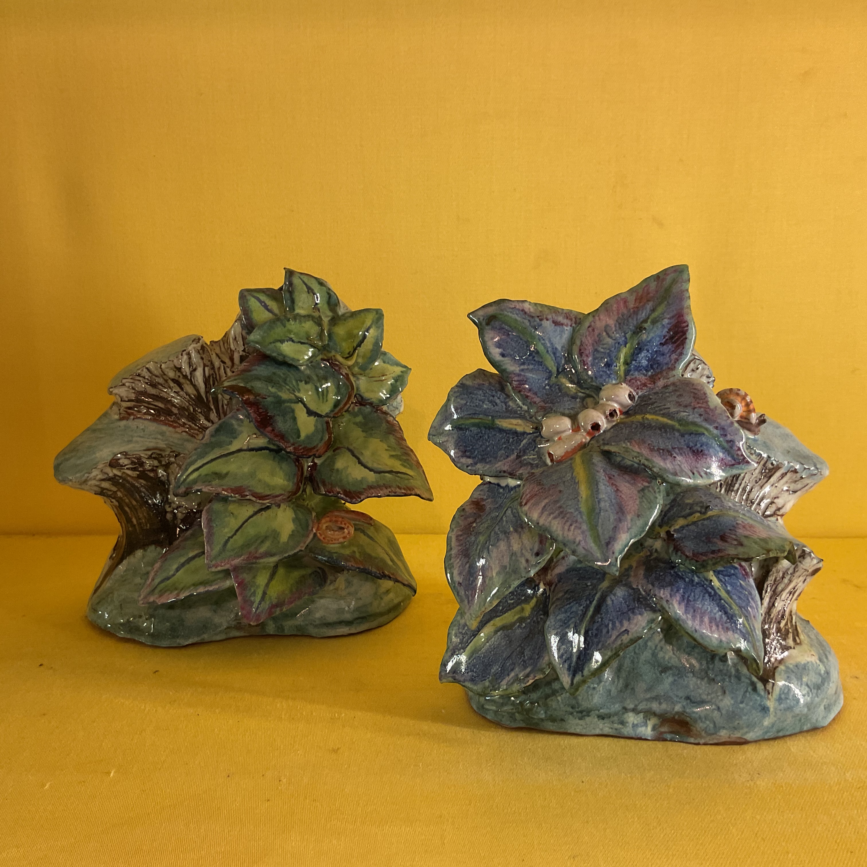 A pair of Anne Gordon (Marchioness of Aberdeen) faience bookends