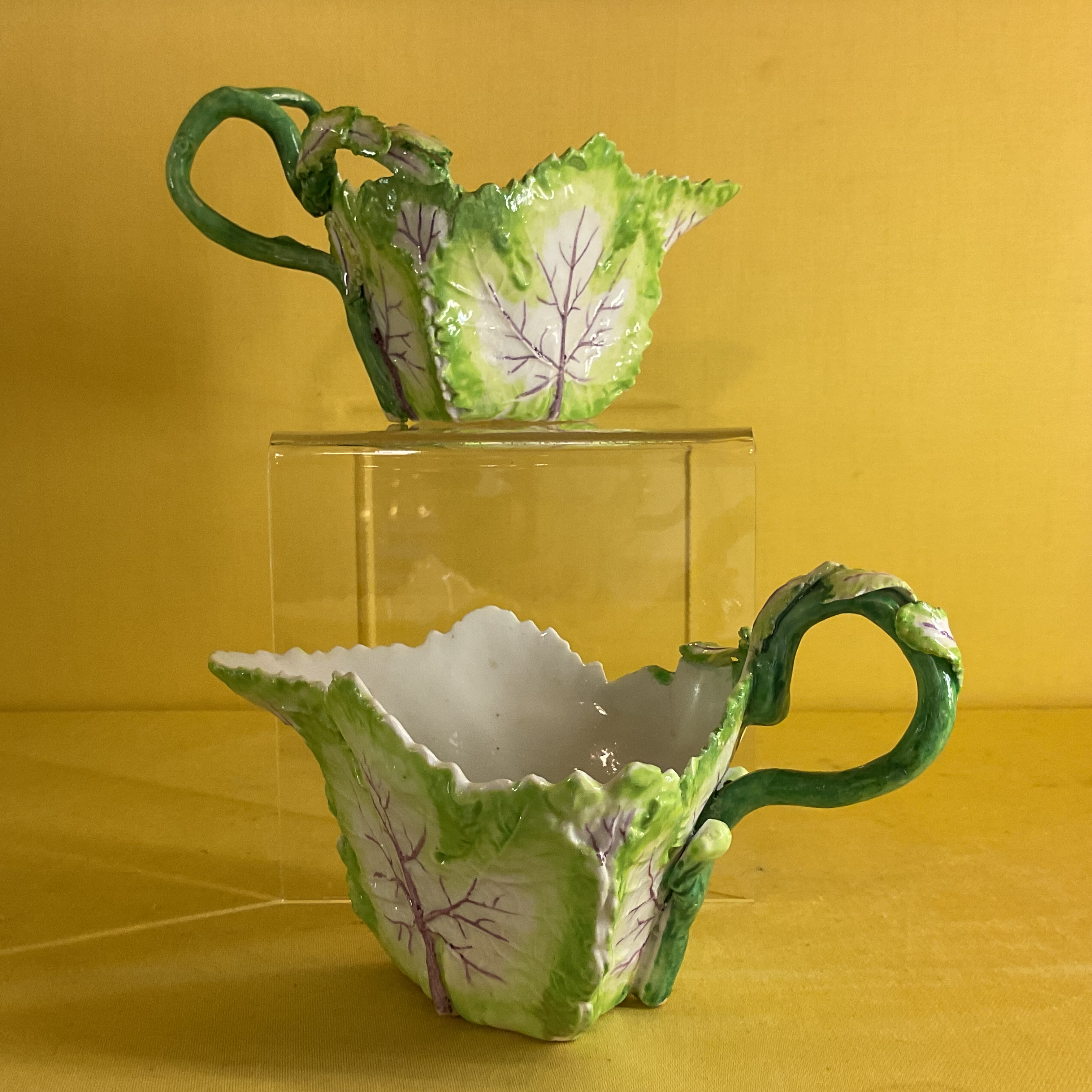 A pair of Longton Hall cabbage leaf moulded small sauce boats 