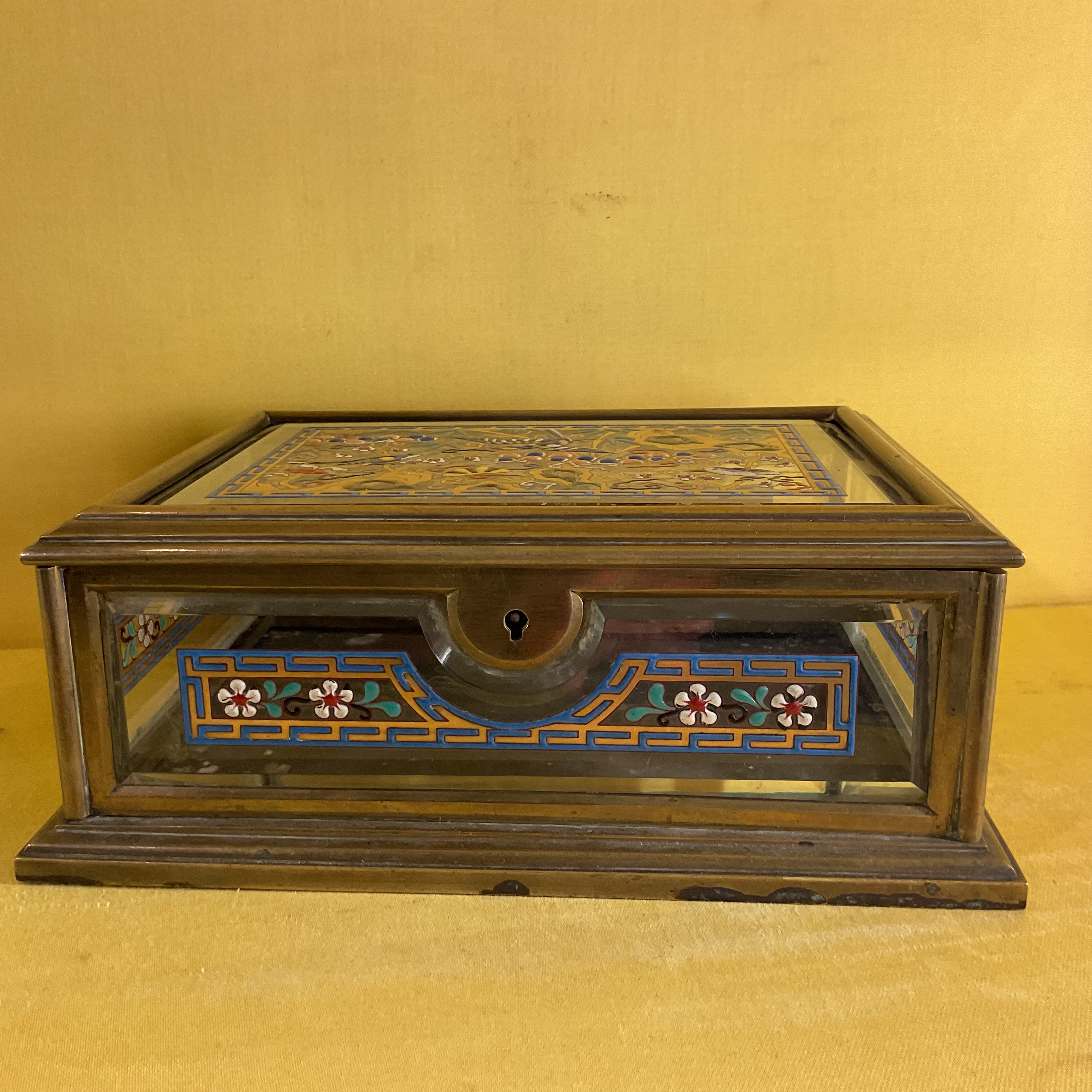 A French Art Deco brass and glass casket 