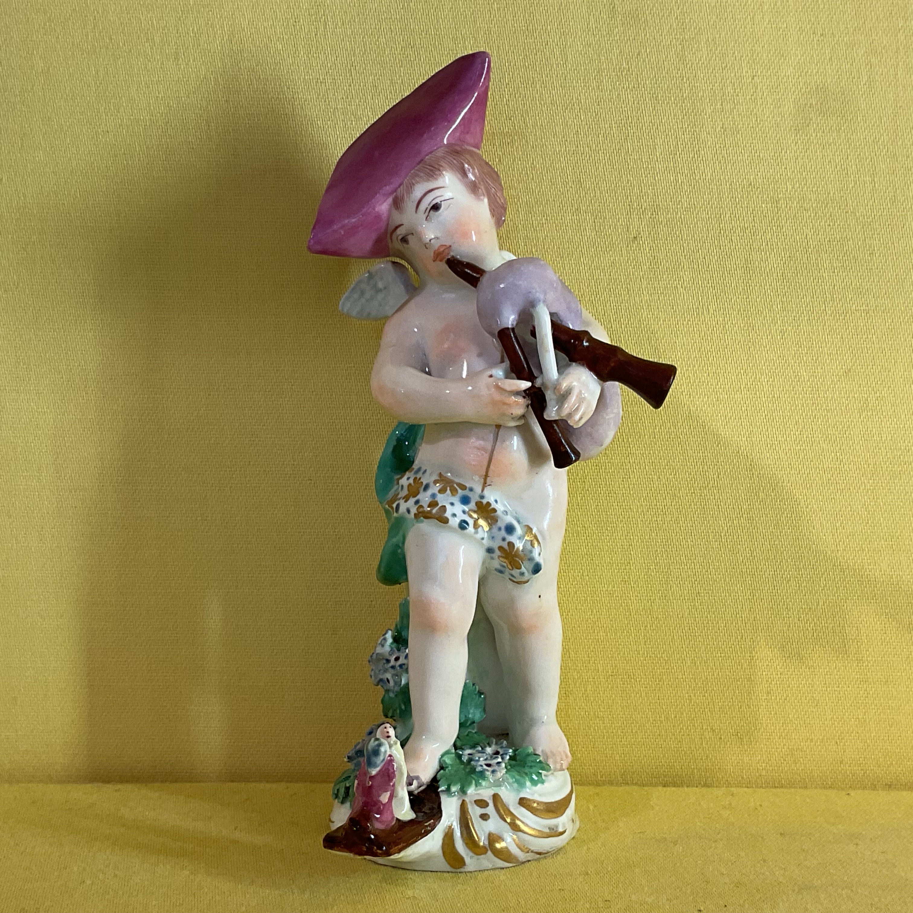 A Chelsea figure of Cupid 