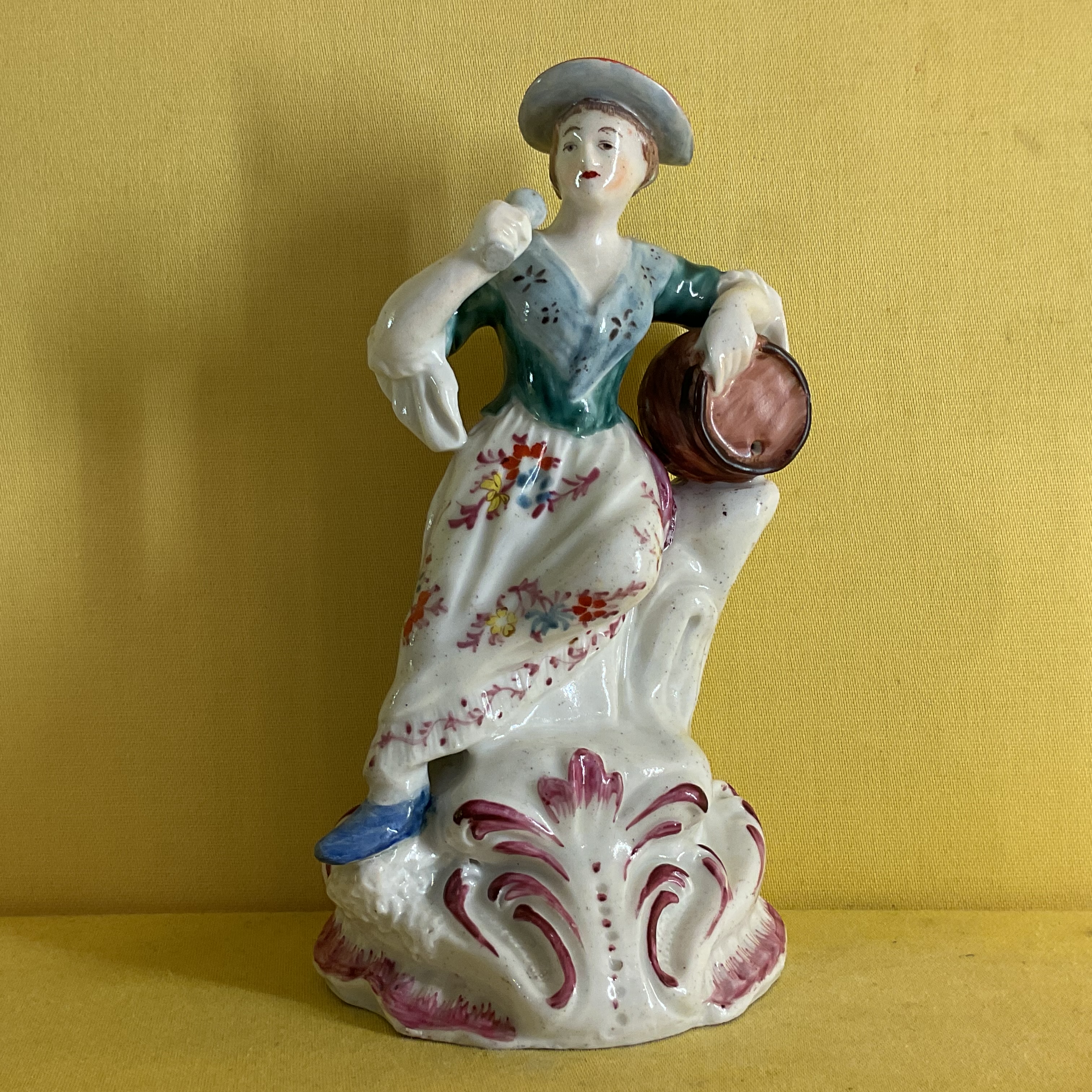 A Plymouth figure of a female toper 