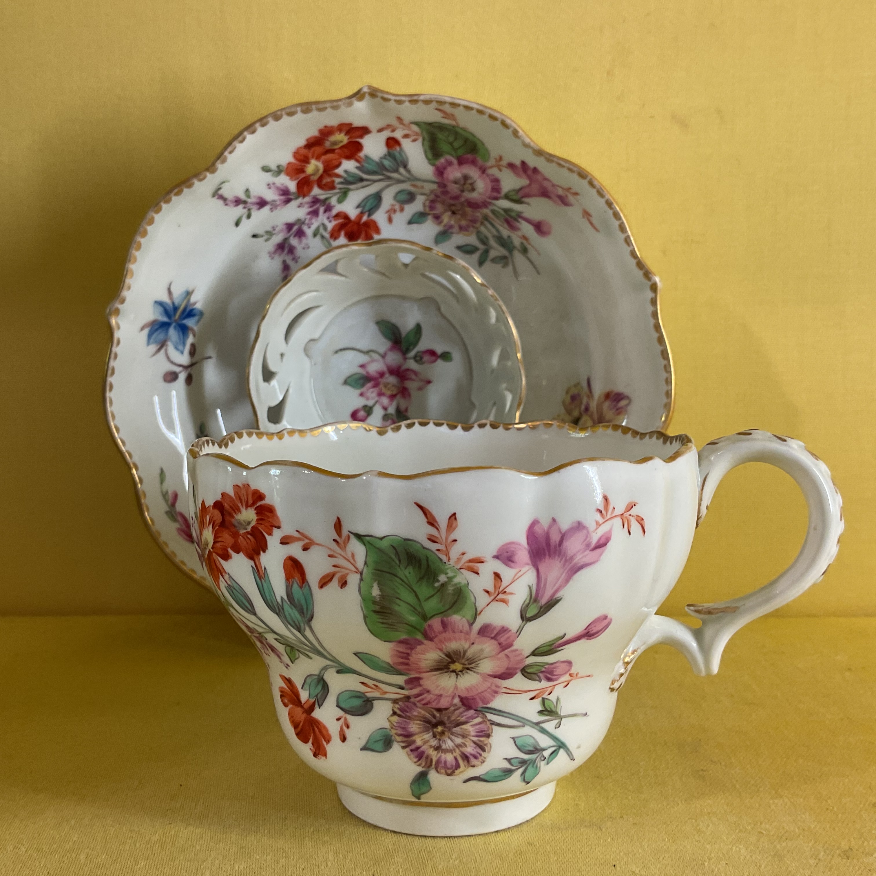 A rare Bristol chocolate cup and trembleuse saucer 