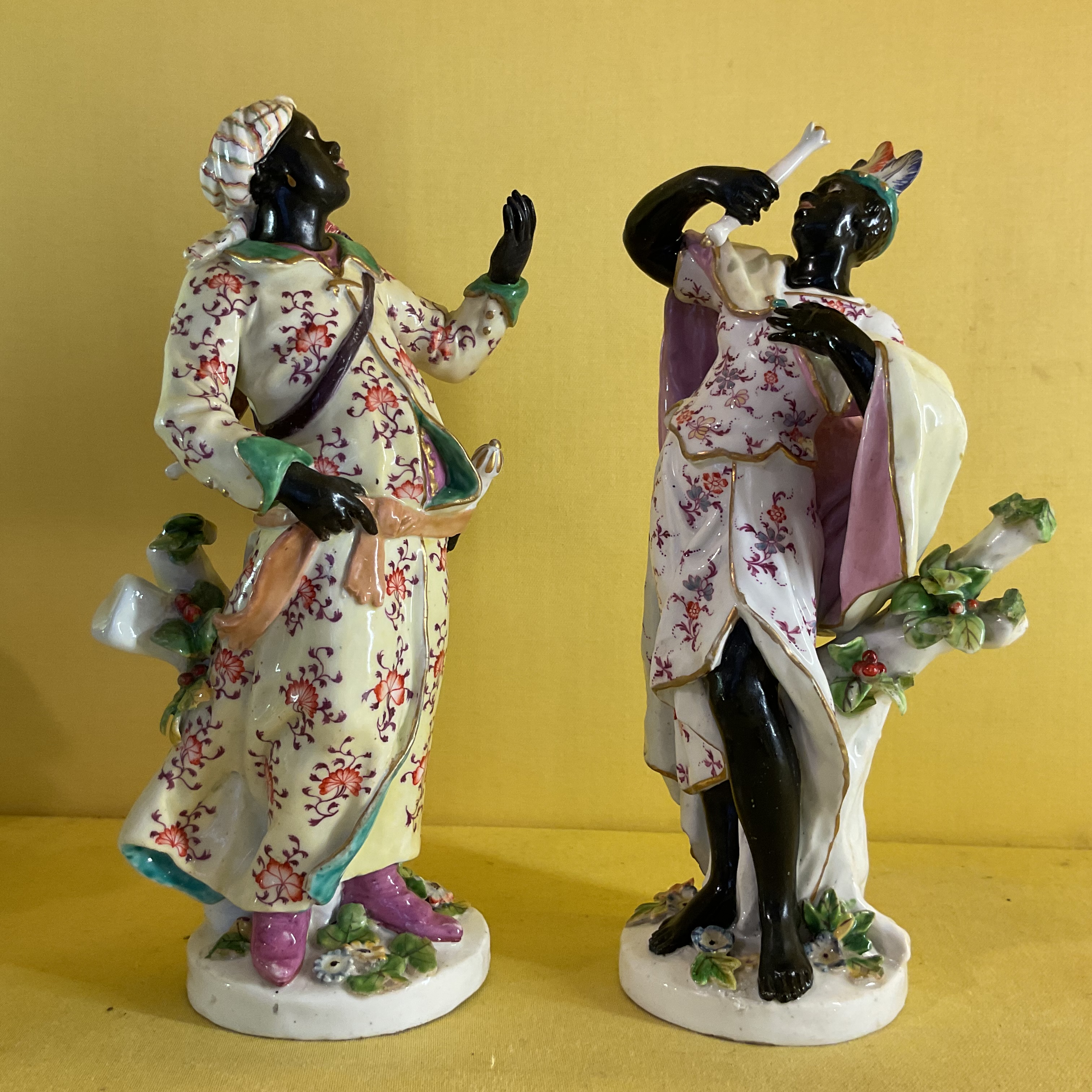 A very rare pair of Chelsea figures of the Abyssinian Archer and Companion 