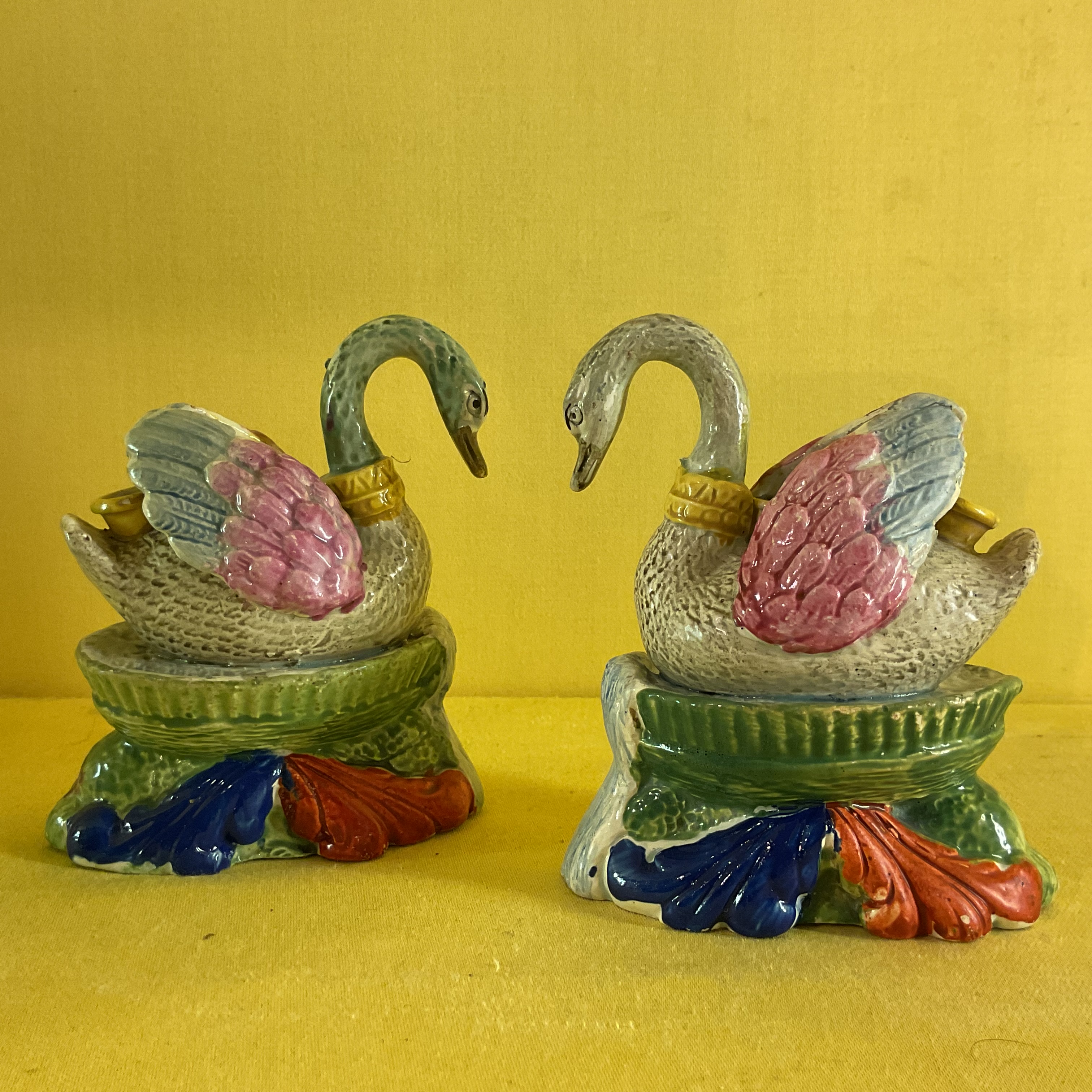 A pair of pearlware swan shaped inkwells 