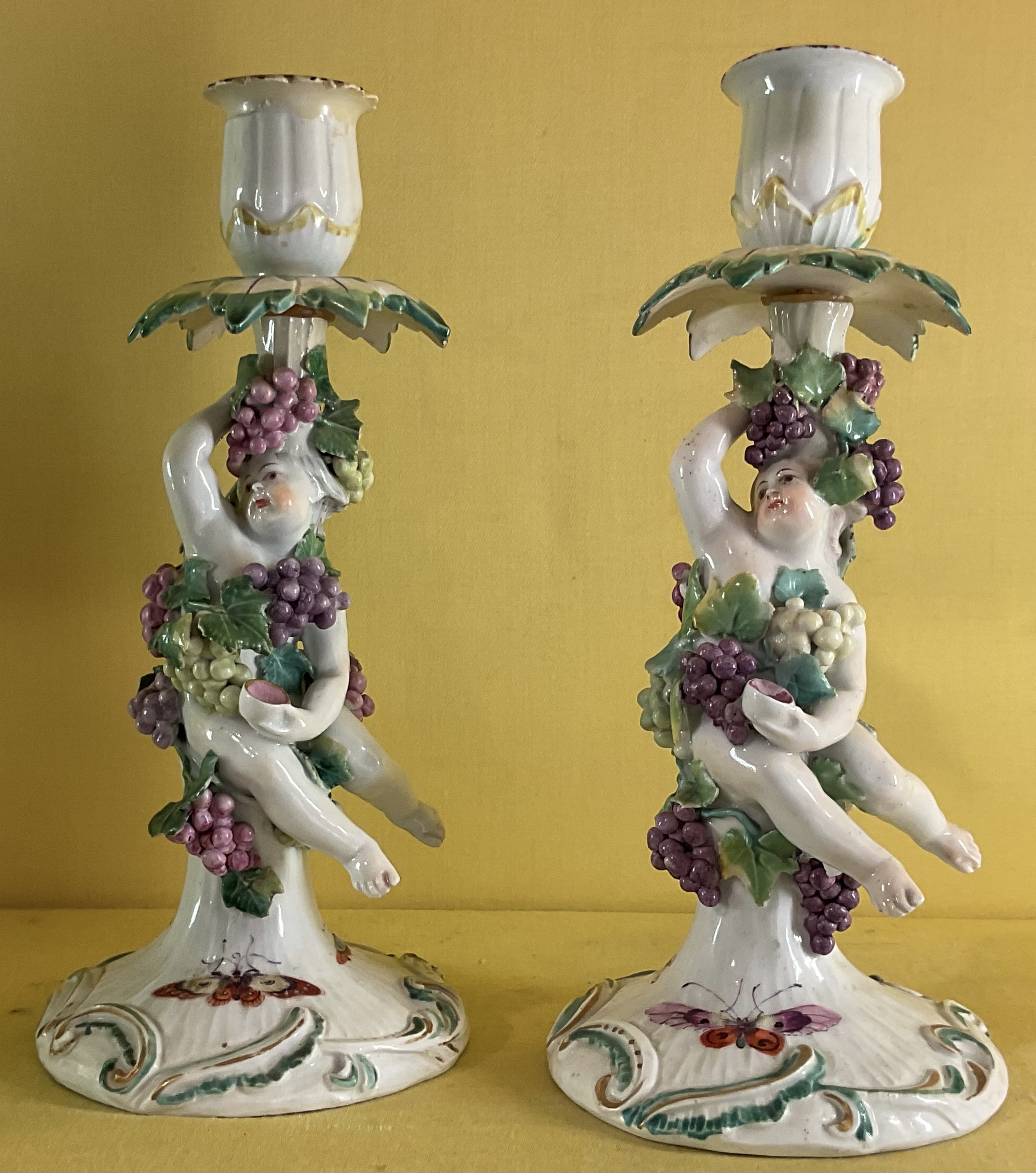 A pair of Derby candlesticks 