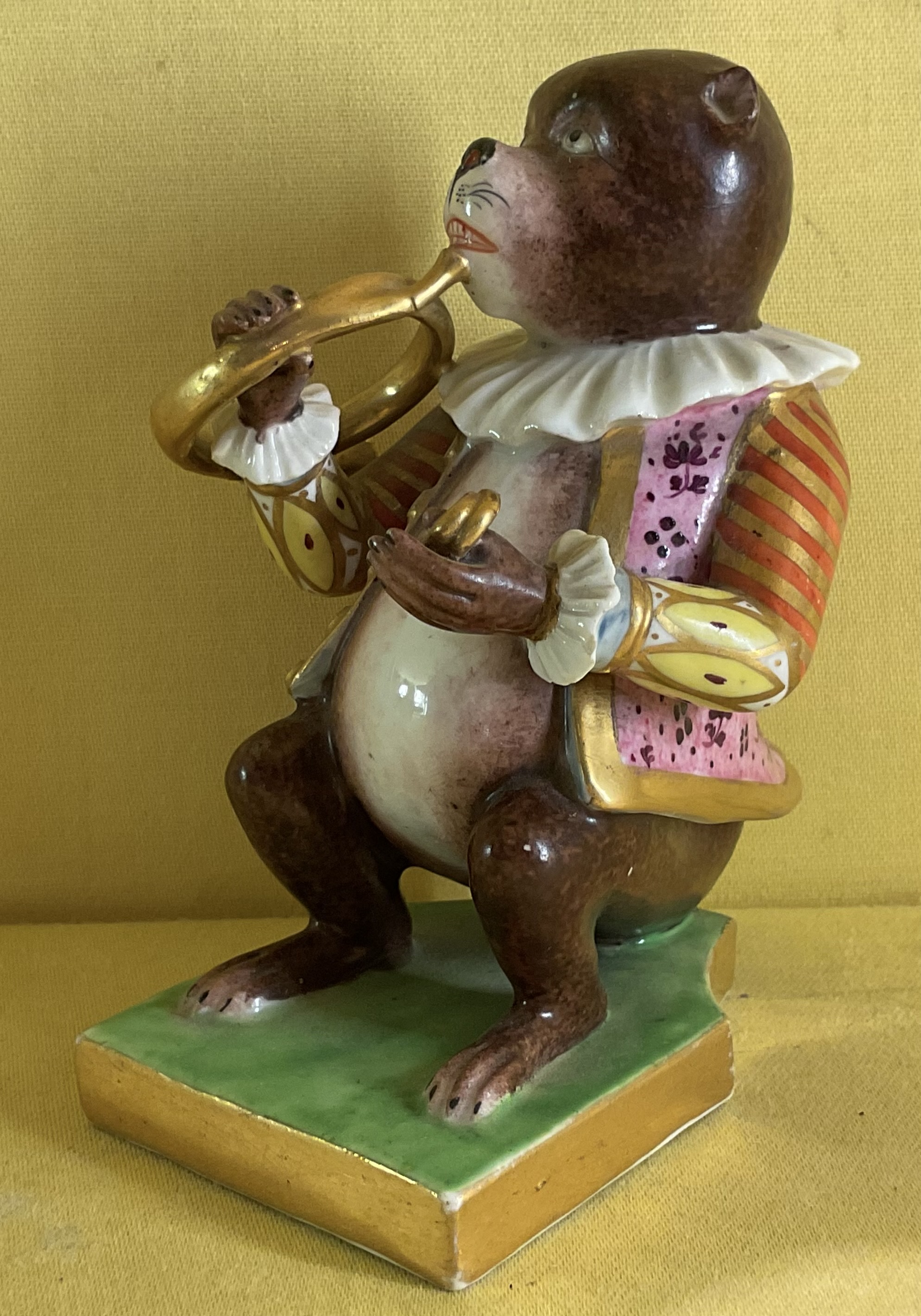 A Bloor Derby model of a monkey musician 