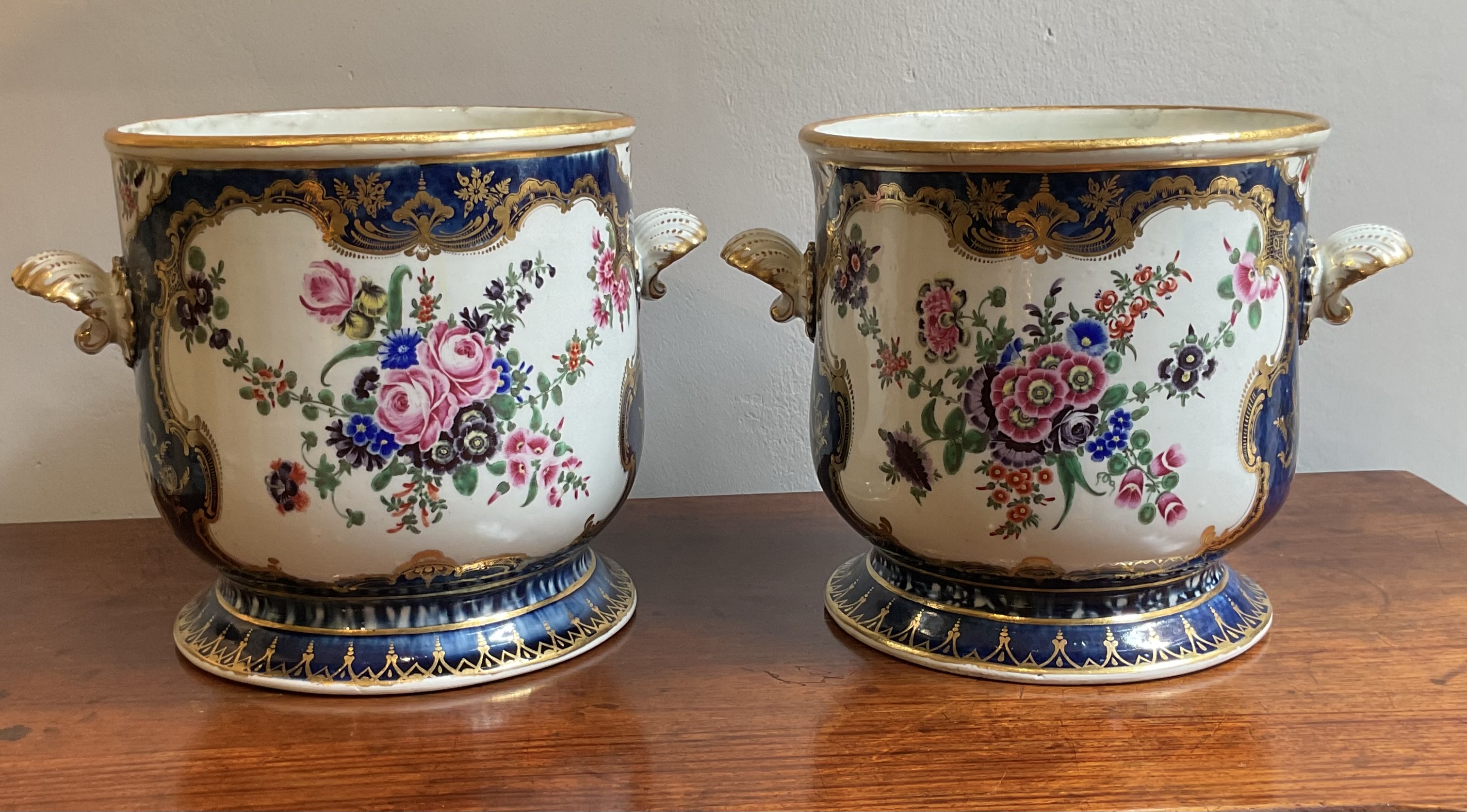 An important pair of Worcester wine coolers 