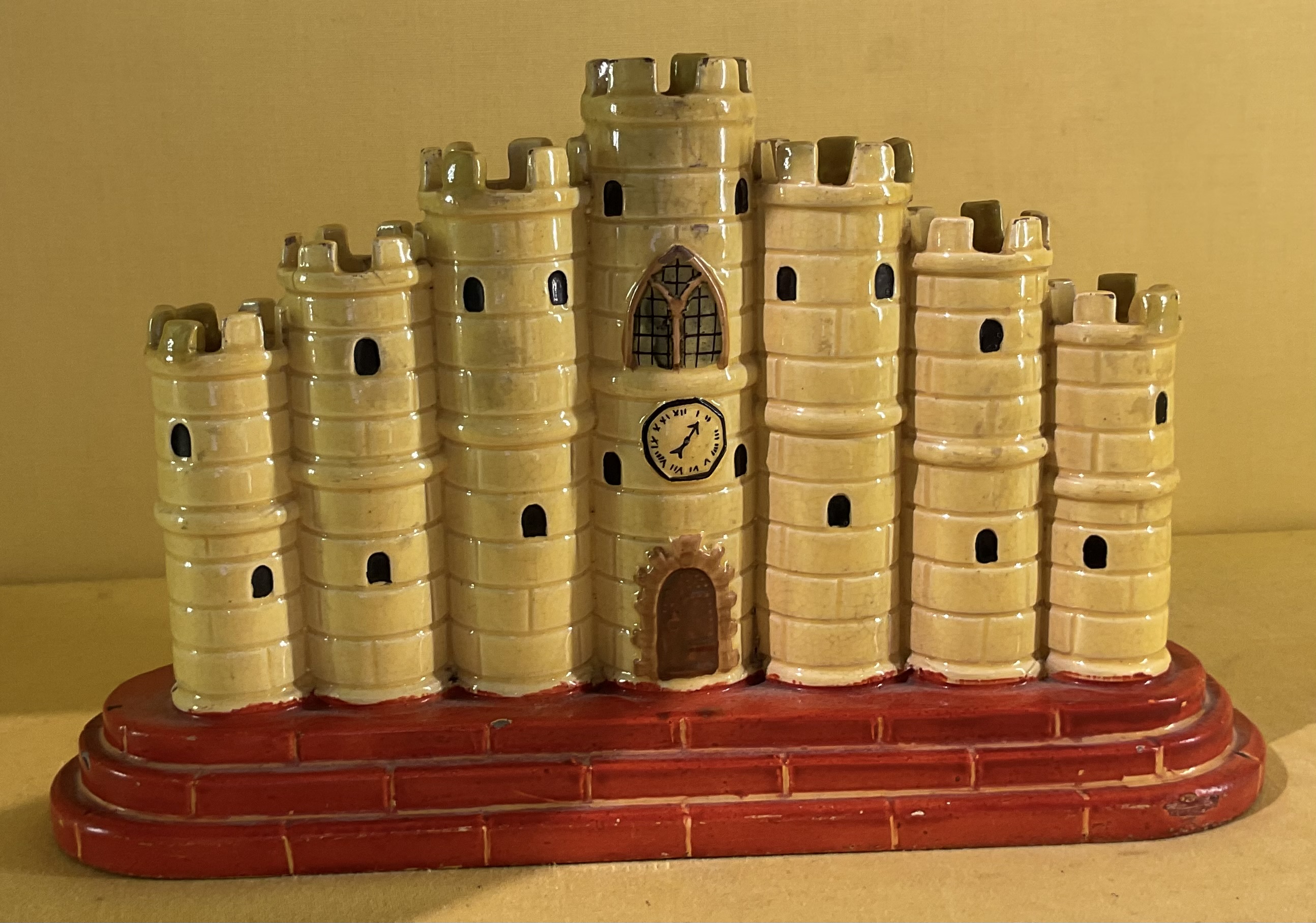 A Staffordshire pottery castle form spill vase 