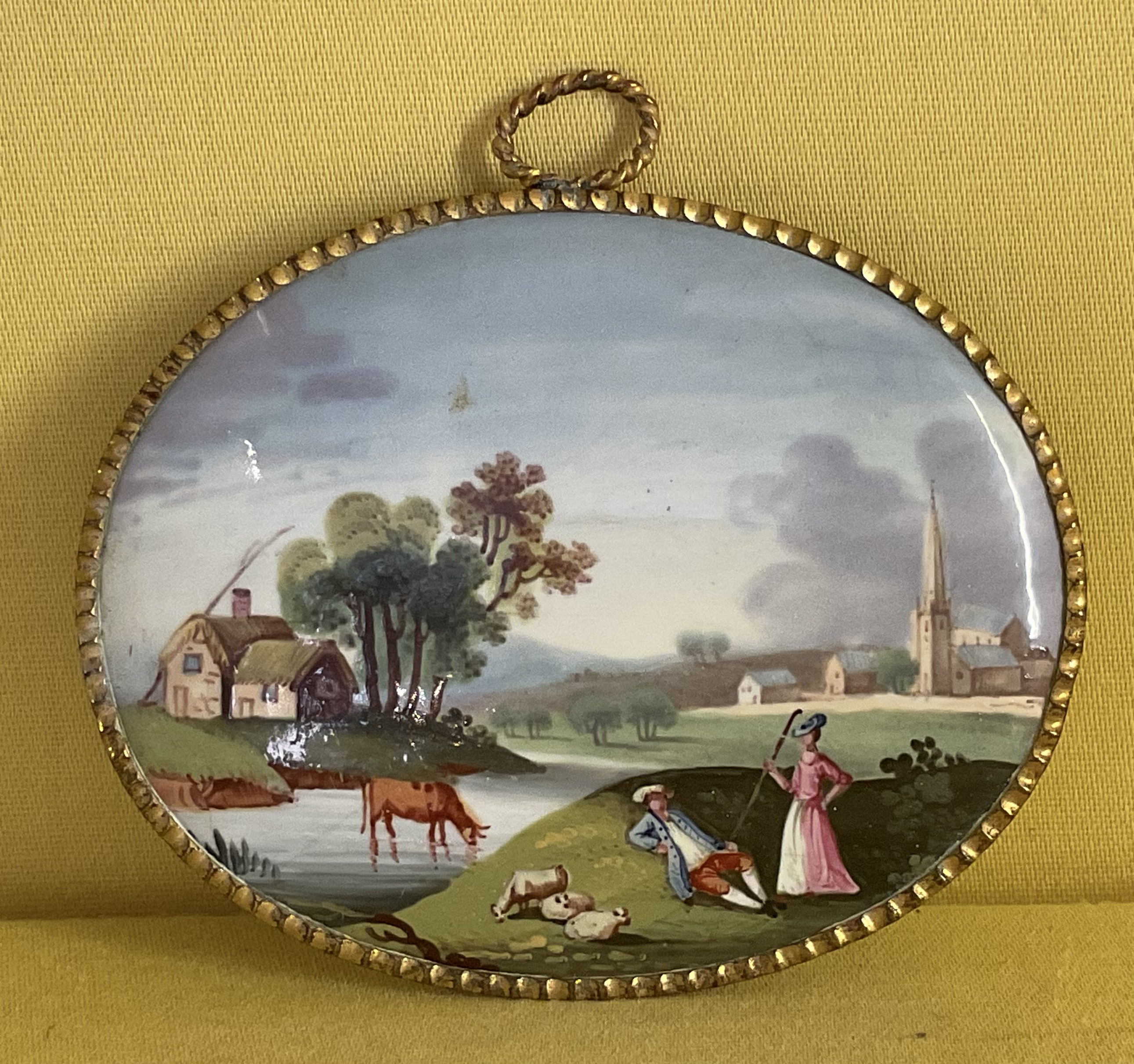 A pair of Birmingham enamel oval plaques