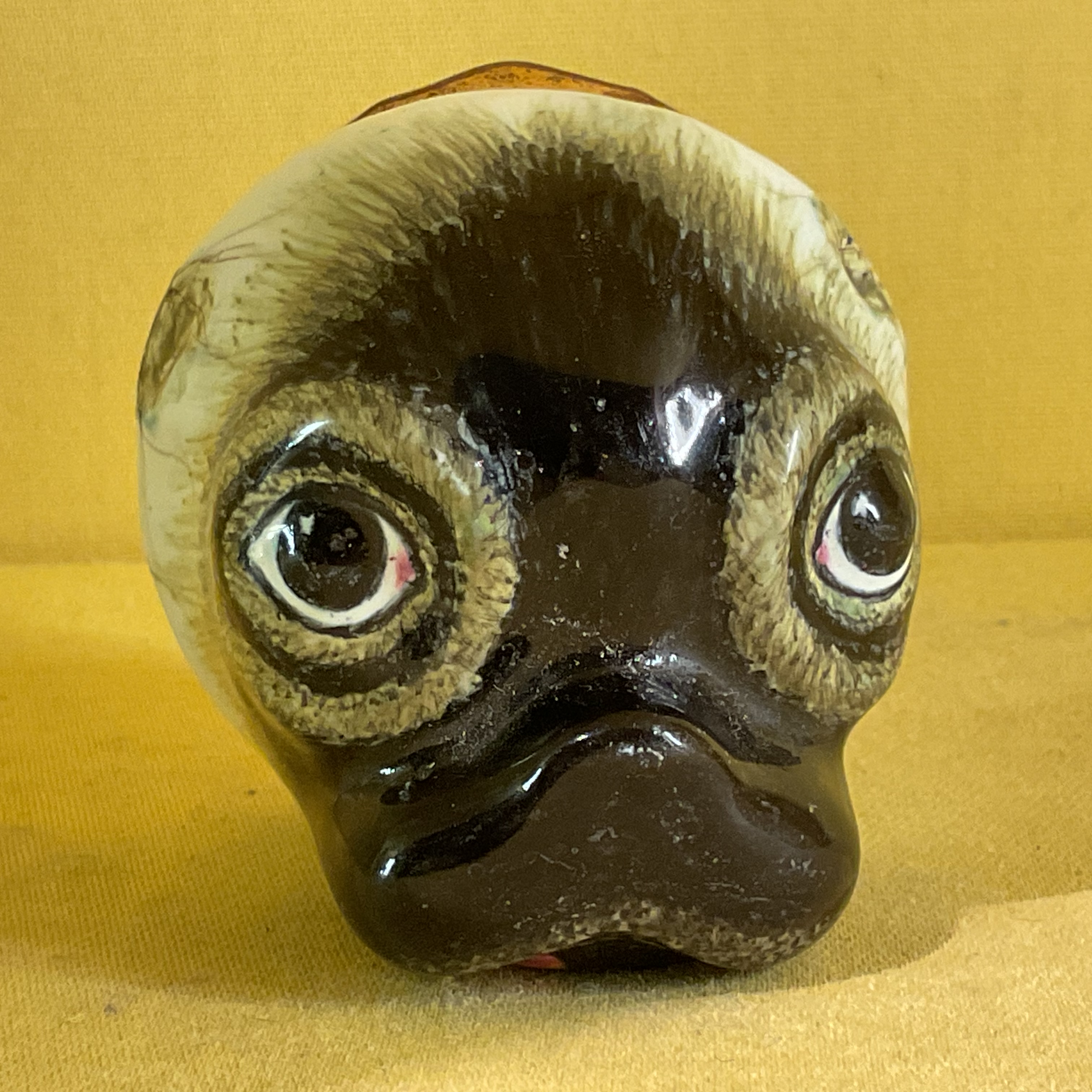 A Staffordshire enamel pug head bonbonniere 