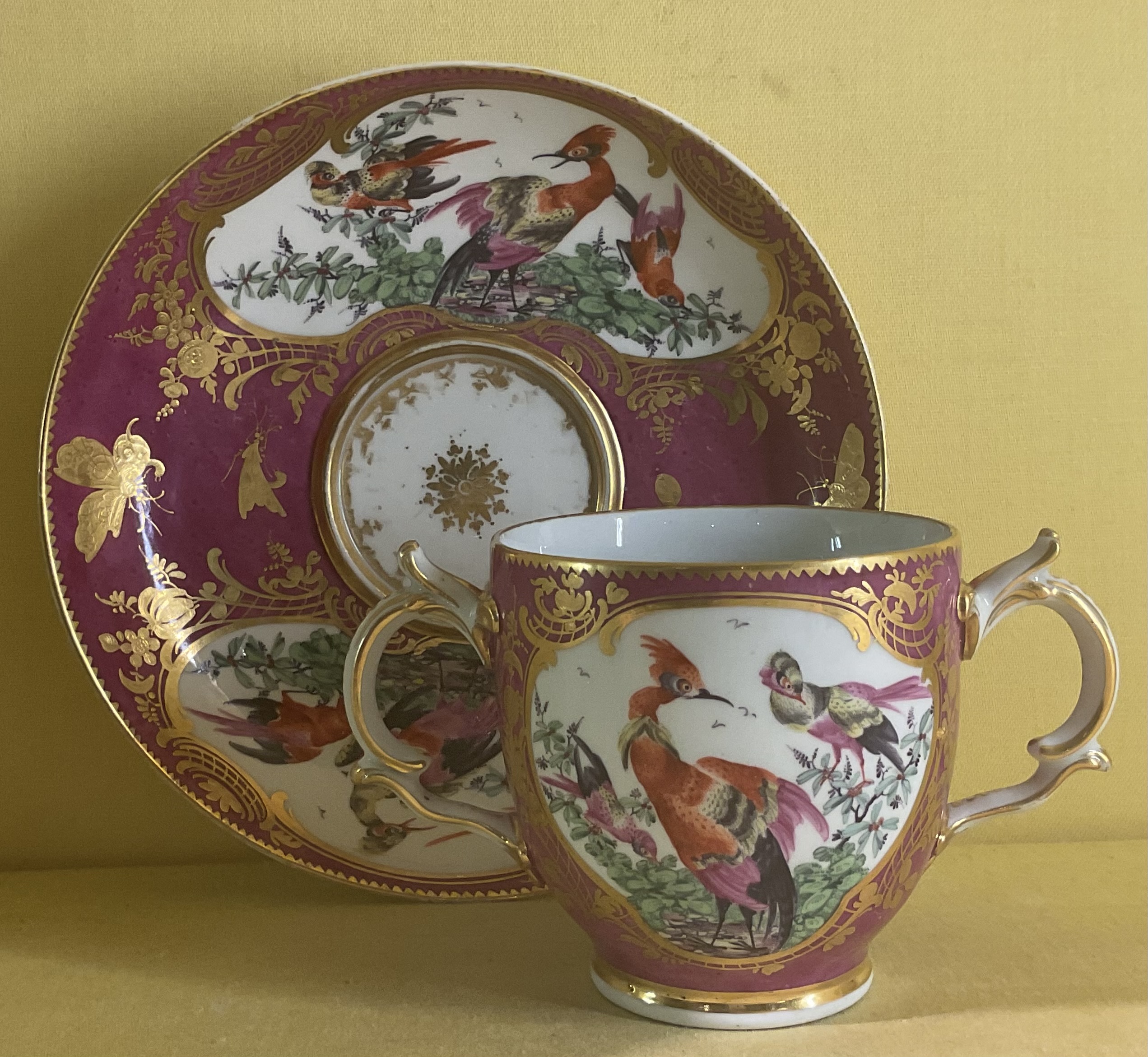 A Chelsea chocolate cup and trembleuse saucer 