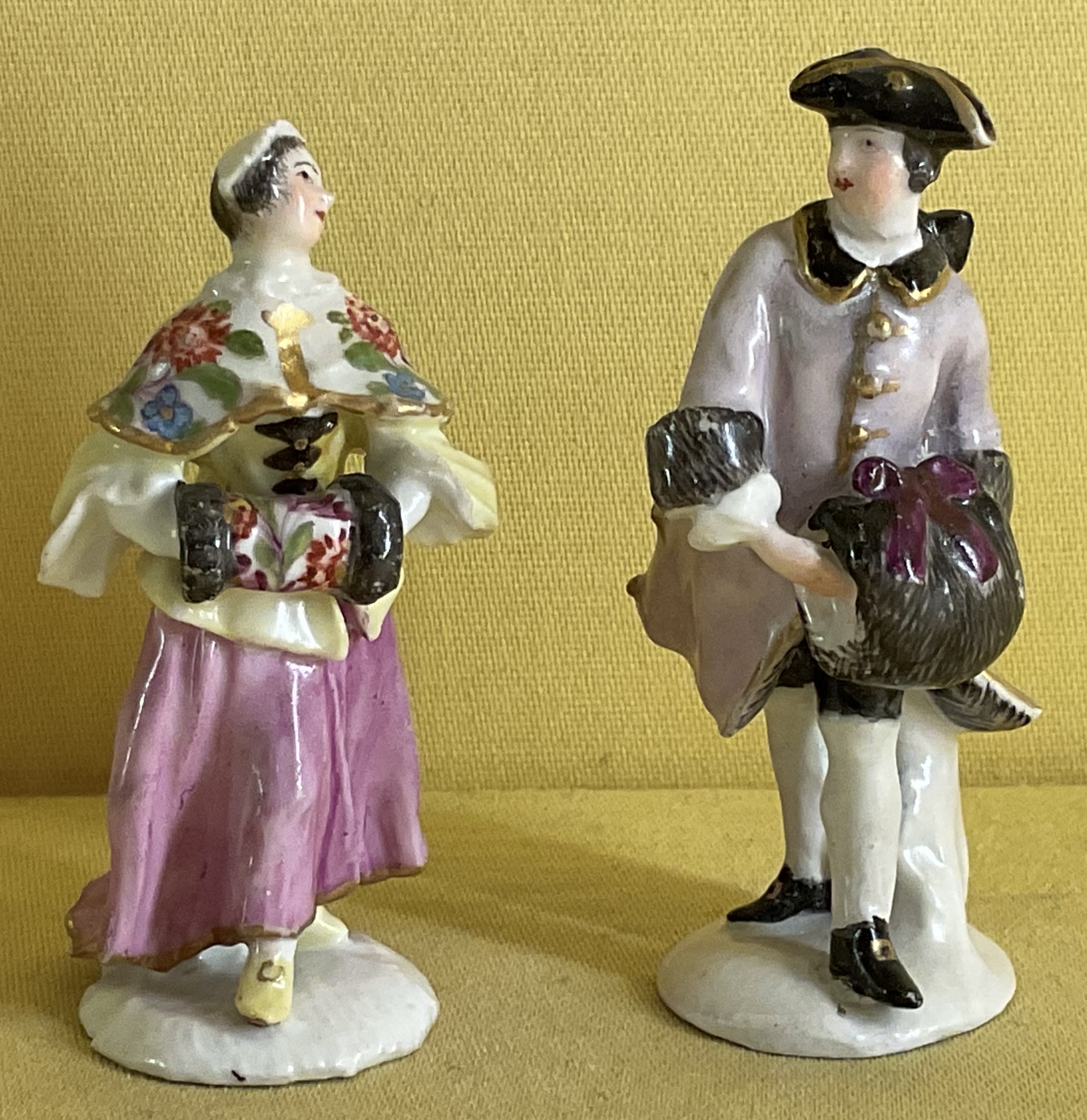 A pair of Meissen miniature figures 